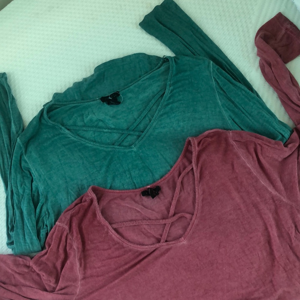 Two long sleeve Rue 21 shirts.